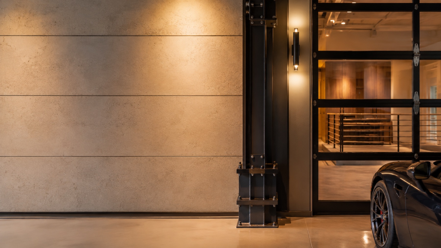 Finished Luxe Dream Garage interior detail with steel column and glass door