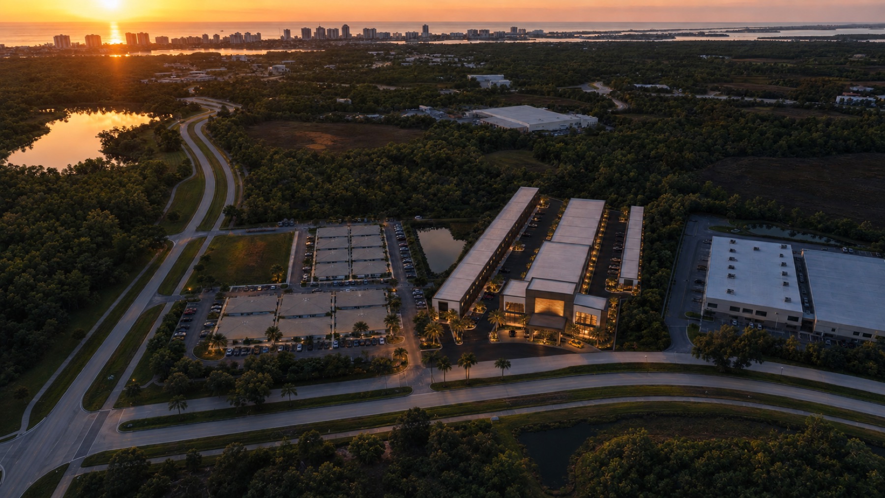 Aerial view from the Waterside campus toward downtown Sarasota and the Gulf at sunset